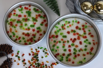Vattayappam with tutti fruity, a Kerala sweet dish. Vattayappam is a steamed rice cake with coconut and yeast