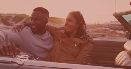 African american couple smiling and enjoying in the car during a roadtrip