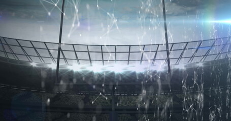 Image of shapes moving on digital screens over sports stadium