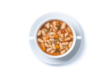 white beans soup with vegetables in white bowl isolated on white background.