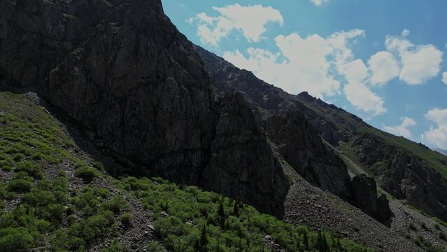 Ala Archa National Park, Bishkek, Kyrgyzstan. Summer mountain landscape, high rocky mountains, river gorge. aerial 4k drone footage. Ala-Archa Highlands, popular place for tourists, travel destination