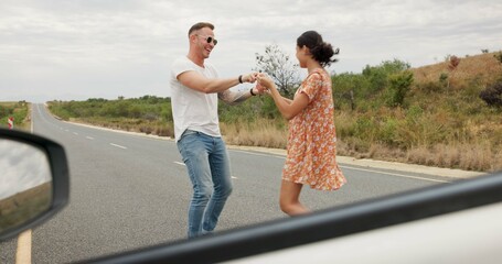 Nature, dancing and young couple on road trip in countryside listening to music together. Happy,...