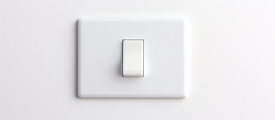 A long flat white on-off switch is attached to a white wall. The switch stands out against the background, creating a simple, minimalist aesthetic.