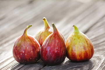 close-up ripe figs fruit on wooden table