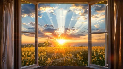 Foto op Plexiglas Stunning view through open window of yellow crops and beautiful sunset through clouds. Evening rays of orange sunshine burst through the house window and open curtains  © Emil