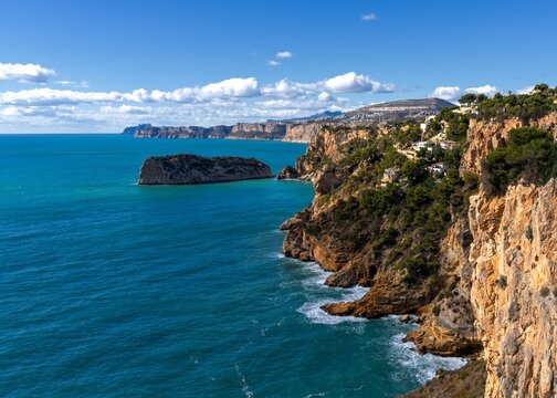 landscape view of the rugged cliffs and shoreline at Cabo de la Nao in Javea Bay