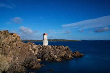 landscape view of the old Capo Ferro Lighthouse in Sardinia
