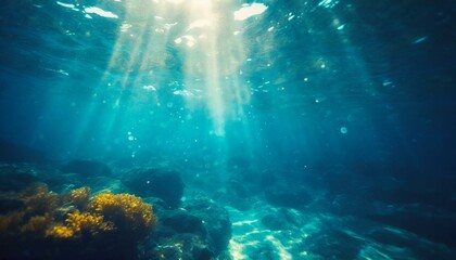 Underwater background with blue water and sun rays. Copy space