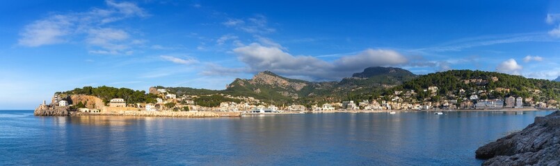 Fototapeta na wymiar panorama view of the natural bay and harbour of Port de Soller in northern Mallorca in warm evening light