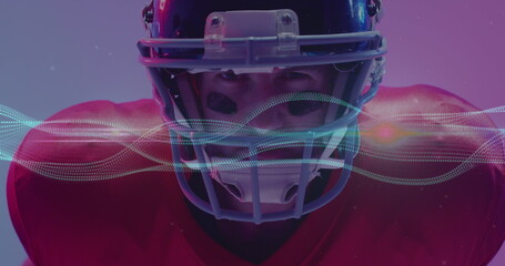 Image of multiple light trails over american football player on neon background