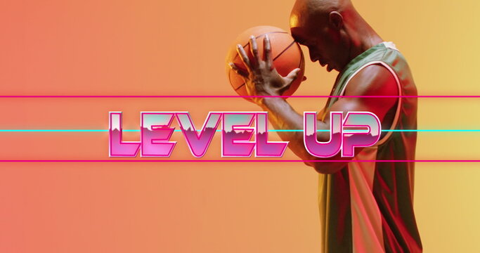Image of level up text over basketball player on neon background - Powered by Adobe