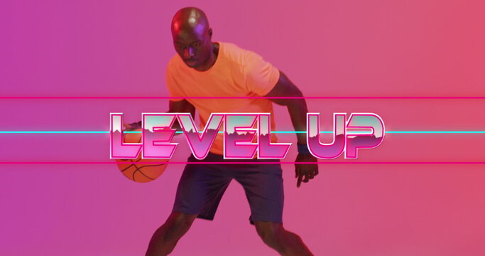 Image of level up text and neon lines over basketball player on neon background - Powered by Adobe