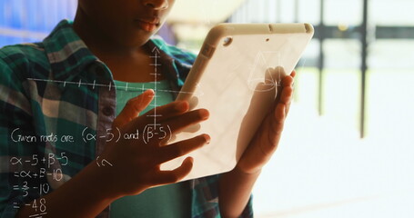 Image of mathematical equations floating over schoolchild using tablet with corridor in the backgrou