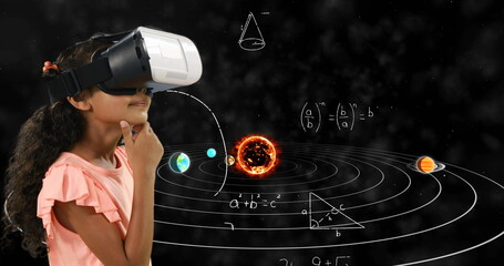 Image of mathematical equations and solar system floating over schoolchild wearing vr goggles