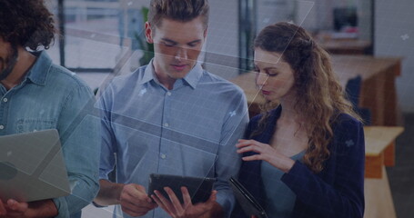 Image of data processing on digital screen over diverse female and male coworkers