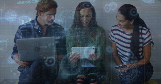 Image of data processing on digital screen over diverse female and male coworkers