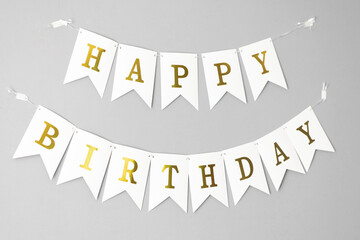 Card template with white Happy Birthday banner flags isolated on grey background. Paper decoration...