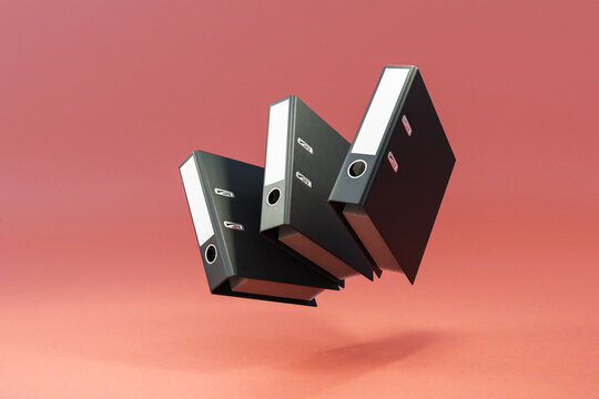 three black folder document binder floating and falling over clean surface; object isolated on infinite background; 3D rednering