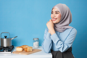 a muslim asian woman in kitchen, Muslim Asian woman in a modern kitchen, showcasing culinary skills and cultural diversity