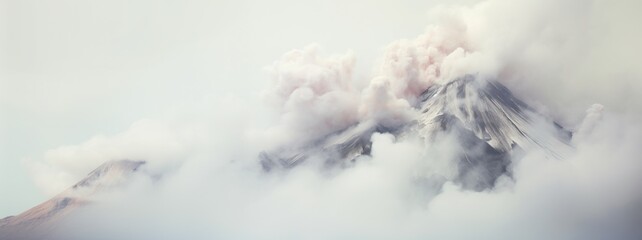 The top of active volcano mountain in the clouds or smoke. Abstract background.