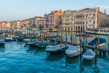 Zelfklevend Fotobehang Small boats at pier in Venice, Italy © Xavier Allard