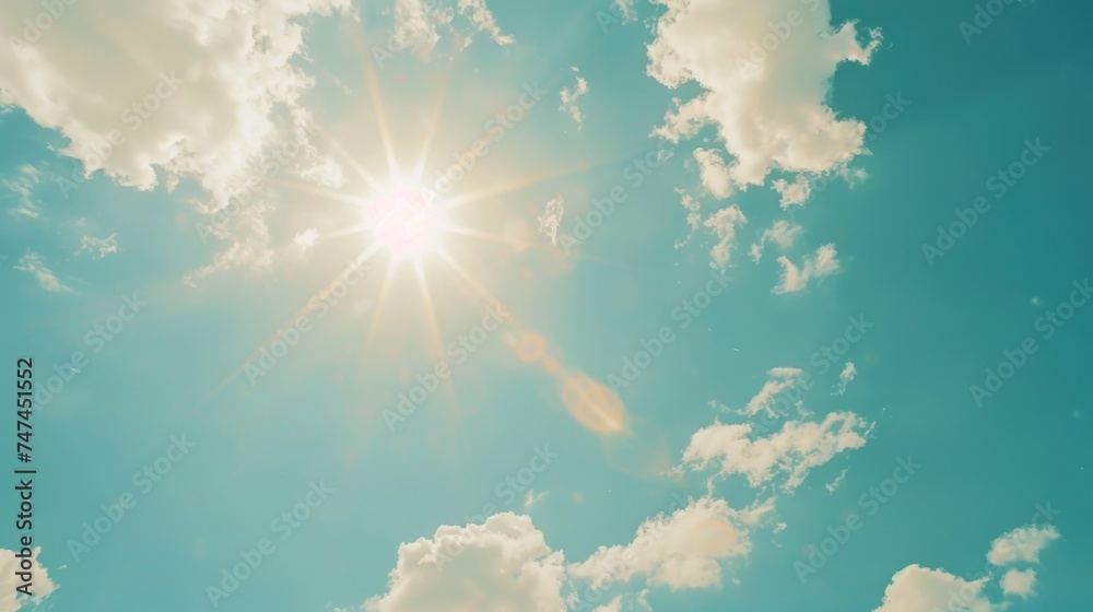 Poster sun shining brightly through clouds in a blue sky, ideal for nature and weather concepts