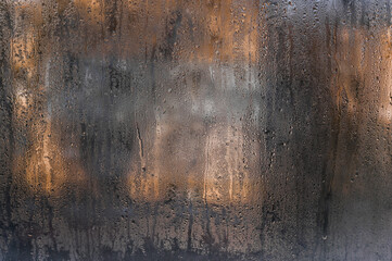 a wet fogged window with water droplets - obrazy, fototapety, plakaty