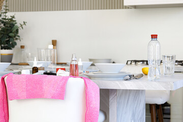 mess in the kitchen, a lot of different unwashed dishes