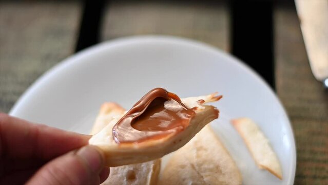 slow motion video of fat cake or criollito with dulce de leche showing the brightness and color