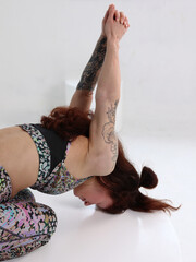 Beautiful Yoga woman doing back stretching exercises . Pain relief, Scoliosis Posture correction.