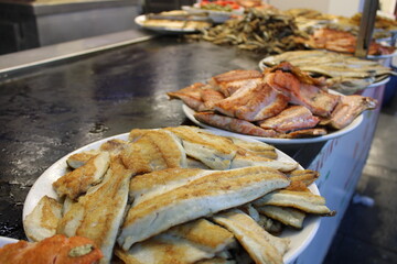 fried fish on the counter. fresh and delicious salmon