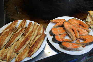 fried fish on the counter. fresh and delicious salmon