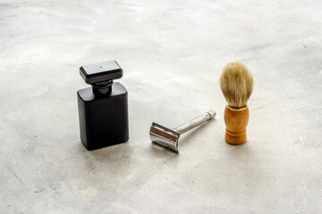 Men perfume and shaving tools. Male accessories close up