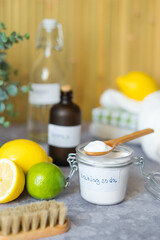 Eco-friendly cleaning products white vinegar, baking soda, lemon, brush. Green cleaning alternatives on different surfaces remove stains. Conscious and environmentally friendly. Zero waste concept.