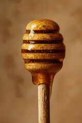 Close-up of a honey dipper with honey dripping down.