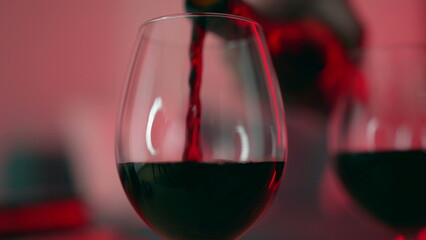 Red Wine Pour for Evening Celebration, Moderation and Elegance. Serving alcoholic drink