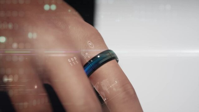 smart ring on human finger with data user interface overlay. Glowing lights around. Modern technologies