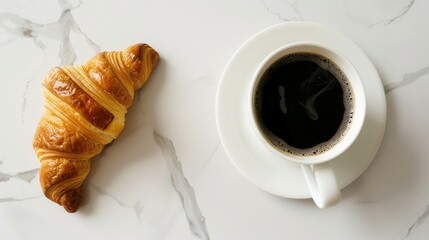 Morning Serenity. A Flaky Golden Croissant Beside a Cup of Rich Black Coffee on a Marble Surface. The Quintessential Start to the Day with a Crisp Pastry and Aromatic Brew on Elegant Marble