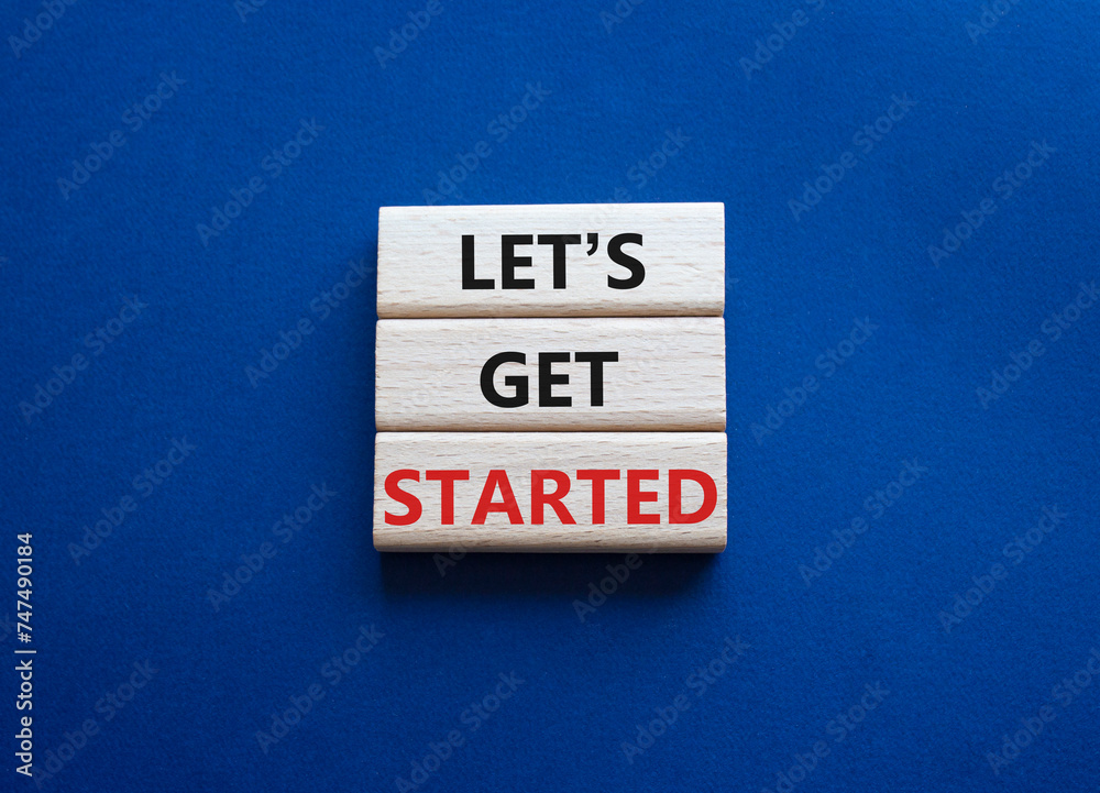 Canvas Prints lets get started symbol. concept words lets get started on wooden blocks. beautiful deep blue backgr