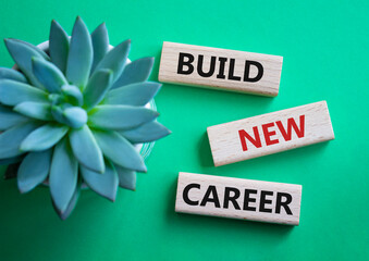 Build new career symbol. Concept word Build new career on wooden blocks. Beautiful green...