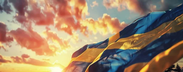 Foto op Aluminium Close up waving flag of Sweden on background of sunset sky. Flag symbols of Sweden © Coosh448