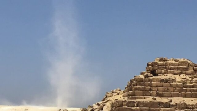 A dust devil spinning around at the Giza Necropolis 