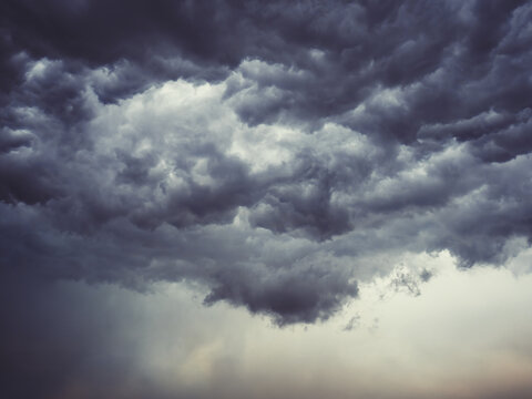Dramatic blue sky with clouds. Spooky abstract background pattern texture. Horror, Halloween, evil, armagedon, apocalypse concept.