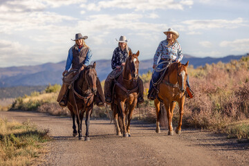 Cowgirl friends riding horses