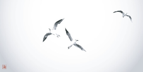 Minimalistic ink painting, displaying a trio of seagulls in flight. Traditional oriental ink painting sumi-e, u-sin, go-hua. Hieroglyph - sea