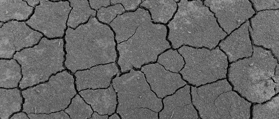 Wall texture soil dry crack pattern of drought lack of water of nature brown old broken background.