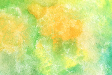 Fototapeta na wymiar Bright multicolored watercolor texture. Abstract hand-drawn background in green and yellow colors.