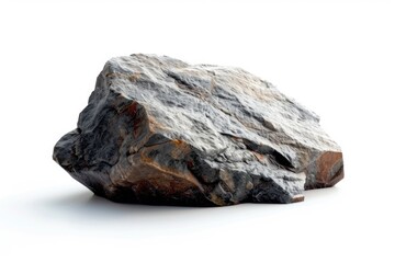 A large rock sitting on top of a white surface. Perfect for backgrounds or textures