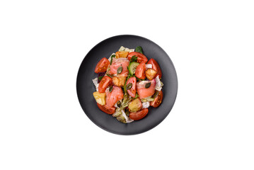 Delicious juicy salad with salmon, tomatoes, cucumber, herbs, pumpkin seeds