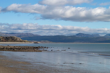 Beautiful Criccieth, Wales. View of the pristine beach at this small Welsh seaside resort at charming Llyn Peninsula. Winter landscape. View over Cardigan Bay to Black Rock sands and Snowdonia.